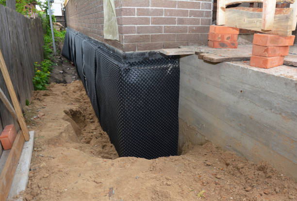 SJ Waterproofing Pros technician performing targeted Basement Waterproofing assessment in Chester Springs, PA